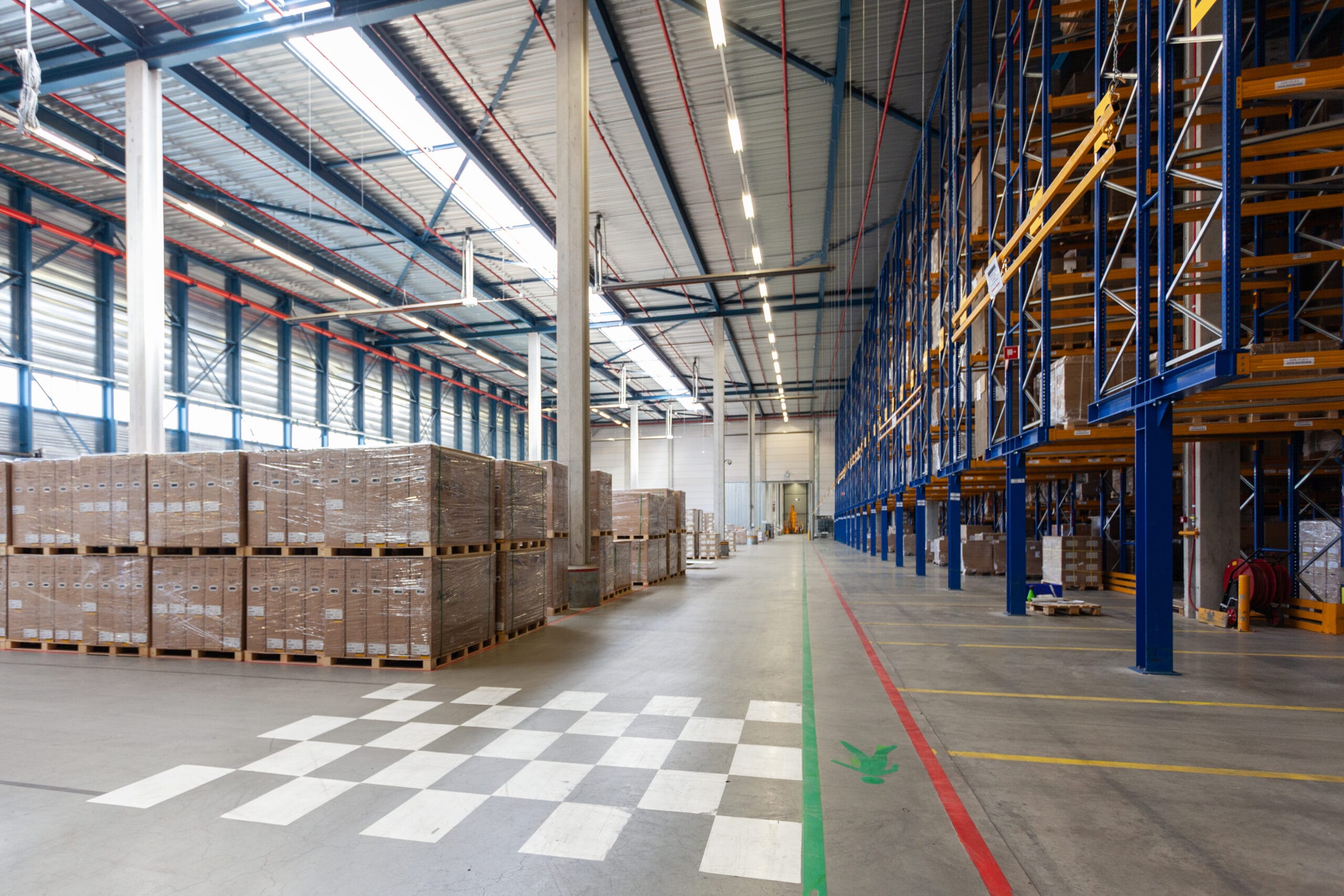 view of full warehouse with forklift